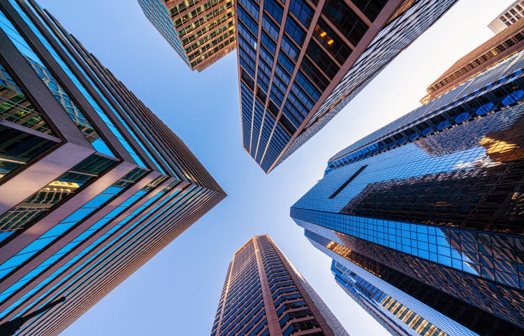 Towering glass skyscrapers viewed from the ground